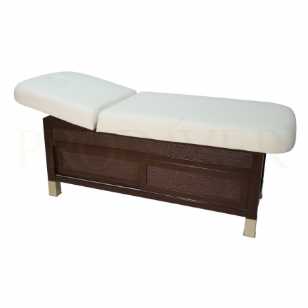 Two-body thai massage table. Adjustable tilt in the headboard area is manual. It has a lower unit with sliding doors, a hole with a cushion and adjustable feet. Soft, cream-coloured PU nappa.